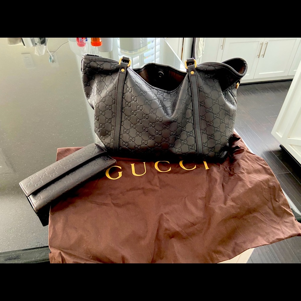 Gucci Guccissima matching bag and wallet.